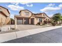 Charming home featuring a three-car garage and a well-maintained front yard at 5636 E Libby St, Scottsdale, AZ 85254