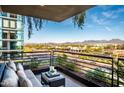 Inviting balcony seating area with city views, featuring a contemporary design and potted plants at 7180 E Kierland Blvd # 508, Scottsdale, AZ 85254