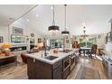 Open-concept kitchen featuring a granite island, stainless appliances, and an eat-in area with natural light at 8165 E Del Marino Dr, Scottsdale, AZ 85258