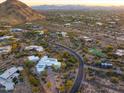 Overhead view of a sprawling desert community with winding roads, pools and mountain vistas at 10029 E Calle De Las Brisas --, Scottsdale, AZ 85255