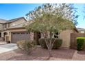 Charming single-story home with a well-maintained yard and desert landscaping at 13225 W Rowel Rd, Peoria, AZ 85383