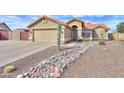 Single-story home with a tile roof and well-maintained desert landscaping including river rock and multiple cacti at 2126 E Sherri Ct, Gilbert, AZ 85296