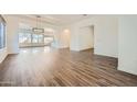Open-concept living room with elegant floors and abundant natural light at 2730 W Via Calabria St, Phoenix, AZ 85086