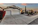 Well-maintained house features a spacious three-car garage, desert landscaping, and a long driveway at 3037 E Bighorn Ave, Phoenix, AZ 85048