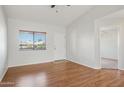 Inviting living room with natural light, wood flooring, and vaulted ceiling at 3301 E Earll Dr # 210, Phoenix, AZ 85018