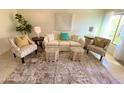 Bright living room featuring stylish furniture, neutral decor, and ample natural light at 3637 E Monterosa St # 5, Phoenix, AZ 85018