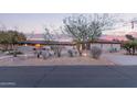 Desert home with beautiful desert landscaping, address on front wall, and desert plants at 36801 N Long Rifle Rd, Carefree, AZ 85377