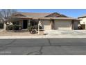 Charming single-story home with a three-car garage and low maintenance desert landscaping at 39642 N Oxford Way, San Tan Valley, AZ 85140