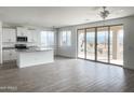 Bright living room featuring sliding doors with views of desert landscape at 6274 S Dean Rd, Buckeye, AZ 85326