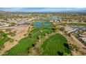 Stunning aerial view of golf course surrounded by water features and lush landscaping at 7800 E Lincoln Dr # 1104, Scottsdale, AZ 85250