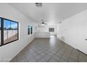 Spacious, bright living room with tile floors and plenty of natural light from large windows at 837 E Minton St, Phoenix, AZ 85042