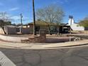 Street view of a single story home in the desirable Royal Desert Mountain Village neighborhood at 9804 N 5Th Ave, Phoenix, AZ 85021