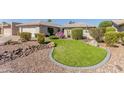 Well maintained front yard with manicured landscaping and rock accents at 10410 E San Tan Blvd, Sun Lakes, AZ 85248