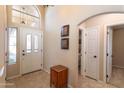 Inviting foyer with tile flooring, high ceilings, and ample natural light at 1363 E Amberwood Dr, Phoenix, AZ 85048