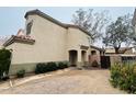 Attractive two-story home with red tile roofing, desert landscaping, and a gravel driveway, perfect for easy maintenance at 1750 W Union Hills Dr # 91, Phoenix, AZ 85027