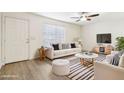 Cozy living room featuring neutral tones, stylish furnishings, and lots of natural light, perfect for relaxation at 2117 W Pontiac Dr, Phoenix, AZ 85027