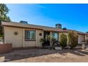 Attractive house with updated windows, desert landscaping, and an inviting facade at 3120 N 67Th Ln # 31, Phoenix, AZ 85033