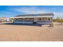 Inviting single-story home with covered parking and desert landscape for relaxed living at 31555 N Royce Rd, San Tan Valley, AZ 85144