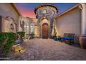 Charming courtyard entrance with brick pavers, stone accents, and a water feature fountain at 31709 N 16Th Ave, Phoenix, AZ 85085