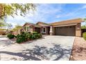 Lovely single-Gathering home with a well-maintained yard, a two-car garage, and a concrete driveway at 3254 N Park St, Buckeye, AZ 85396