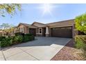 Lovely home with a spacious driveway and attached garage at 3254 N Park St, Buckeye, AZ 85396