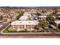 Expansive aerial view of the apartment complex, highlighting its tidy buildings and green spaces in a residential area at 3601 W Tierra Buena Ln # 233, Phoenix, AZ 85053