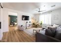 Bright living room with shiplap accent wall, modern furnishings, and lots of natural light at 3840 E Yeager Dr, Gilbert, AZ 85295