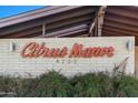 Close-up of the Citrus Manor signage on a charming brick facade with tasteful landscaping at 4203 N 36Th St # 23, Phoenix, AZ 85018