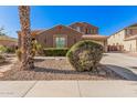 Charming two-story home featuring a well-maintained yard with mature landscaping and an expansive driveway at 4376 S Summit St, Gilbert, AZ 85297