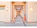 Inviting walkway to the front door, featuring stone accents and stylish lighting fixtures at 4545 S Ellesmere St, Gilbert, AZ 85297