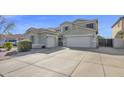 Exterior view of a home featuring an extended driveway and a two-car garage at 10343 E Jacob Ave, Mesa, AZ 85209