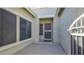 Covered front porch area featuring a security door and sun screens at 10343 E Jacob Ave, Mesa, AZ 85209