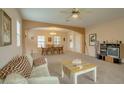 Bright, open-concept living room and dining area featuring an archway, recessed lighting, and neutral tones at 1066 E Sourwood Dr, Gilbert, AZ 85298