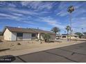 Single story home featuring low maintenance landscaping, two-car garage, and desert landscape at 17626 N Buntline Dr, Sun City West, AZ 85375