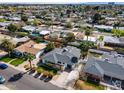 Aerial view of a charming neighborhood featuring well-maintained homes, mature trees, and manicured landscaping at 1837 E Coolidge St, Phoenix, AZ 85016