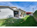 Inviting backyard with a covered patio, dining area, and lush green lawn perfect for outdoor activities at 1837 E Coolidge St, Phoenix, AZ 85016