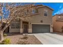 Charming two-story home with a well-maintained front yard and a two-car garage at 19259 N Ventana Ln, Maricopa, AZ 85138