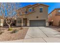 Charming two-story home with a well-maintained front yard and a two-car garage at 19259 N Ventana Ln, Maricopa, AZ 85138