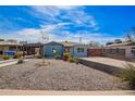 This home features low maintenance landscaping and a covered carport at 217 W Montecito Ave, Phoenix, AZ 85013