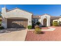 Charming single-story home with a well-manicured yard and a two-car garage at 23034 N Pedregosa N Dr, Sun City West, AZ 85375