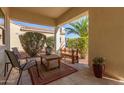 Covered porch with outdoor seating, perfect for relaxing and enjoying the view at 23034 N Pedregosa Dr, Sun City West, AZ 85375