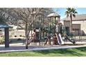 Community playground with slides and climbing structures provide a fun and safe environment for children to play at 2541 S Sunnyvale Ave, Gilbert, AZ 85295