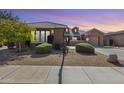 Charming single-story home featuring desert landscaping, a covered porch, and a two-car garage at 2571 E Balsam Ct, Chandler, AZ 85286