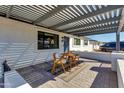 Inviting covered patio with pergola, providing ample shade and an outdoor seating area at 3350 W Charter Oak Rd, Phoenix, AZ 85029