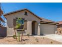 Charming single story home with a tile roof, stucco exterior, and a two car garage at 3906 N 103Rd Ave, Avondale, AZ 85392