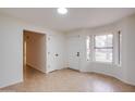 Bright living room featuring neutral paint, tile floors, and natural light at 3938 E Gable Ave, Mesa, AZ 85206