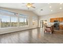 Open floorplan with tile flooring, natural light, and island perfect for entertaining at 40504 N Territory Trl, Anthem, AZ 85086