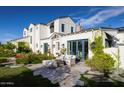 Lovely outdoor seating area with plush furnishings, a lush garden, and manicured landscaping at 4716 N Dromedary Rd, Phoenix, AZ 85018