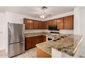 Kitchen featuring granite countertops, stainless steel appliances, and a breakfast bar at 5808 E Brown Rd # 110, Mesa, AZ 85205