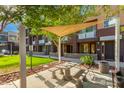 Inviting community area offering shaded picnic tables and manicured green space at 6605 N 93Rd Ave # 1024, Glendale, AZ 85305